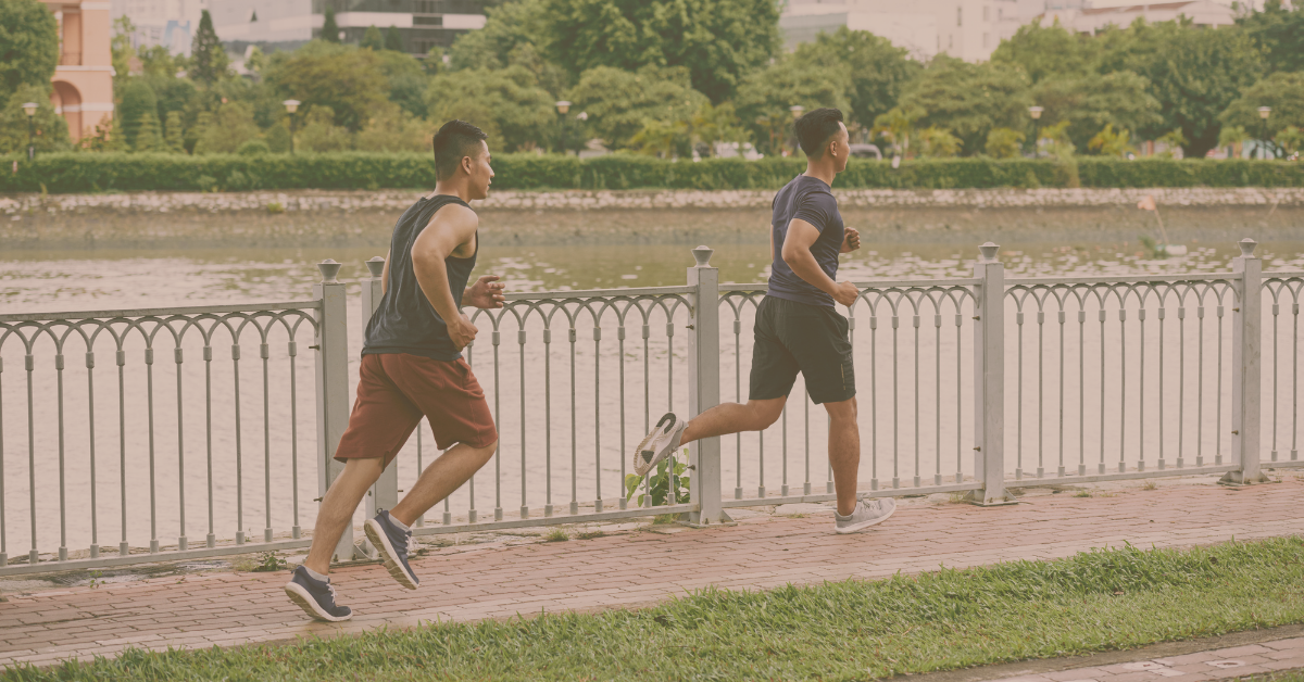 Two people jogging outdoors, symbolizing sustainable weight loss through active lifestyle